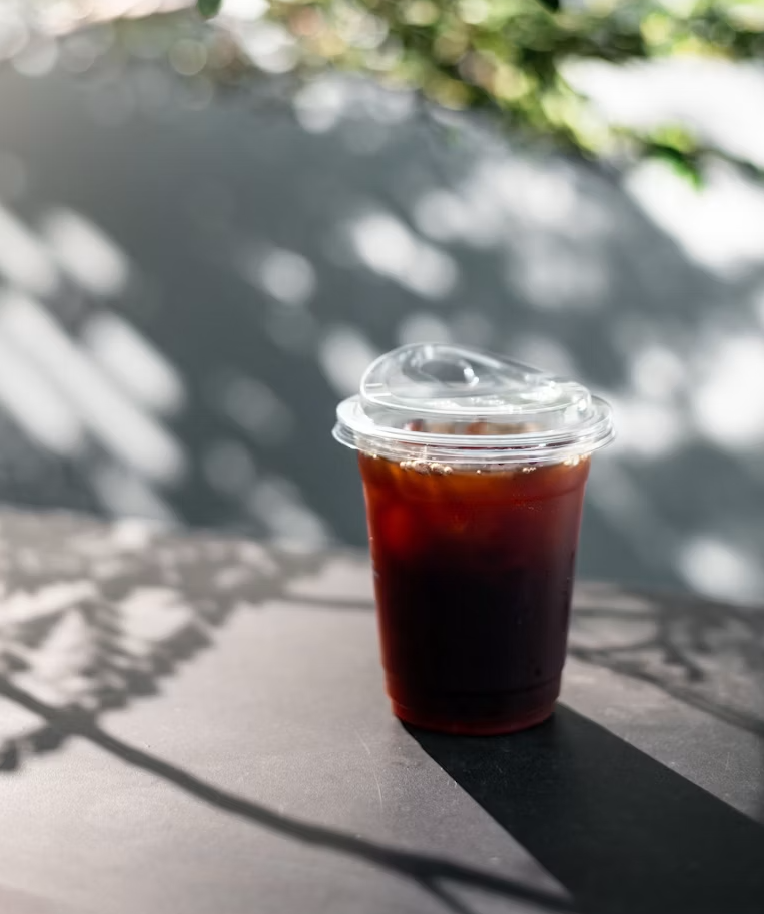 Dappled Amber — iced coffee in dappled sunlight